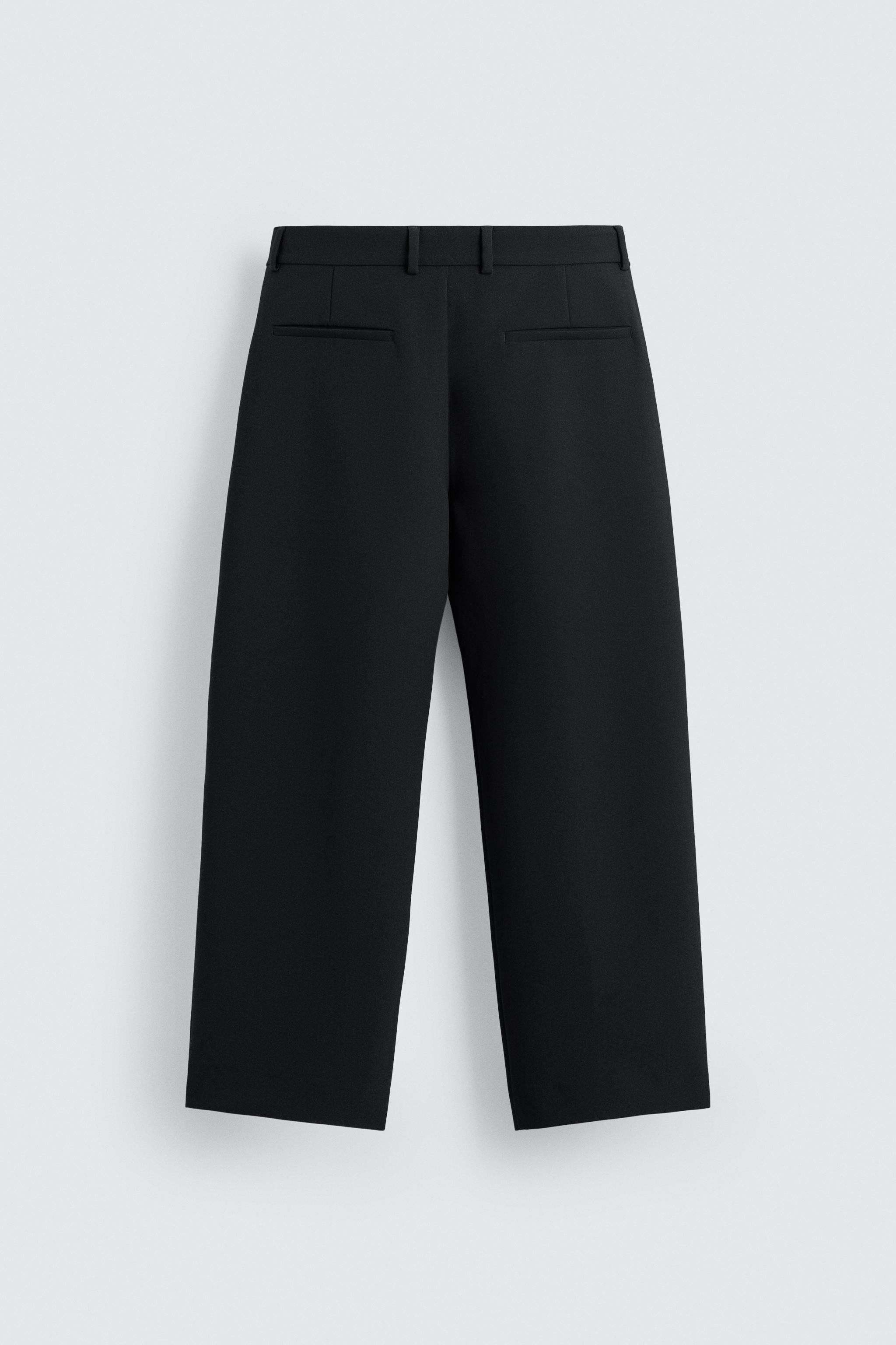 RELAXED FIT PLEATED PANTS